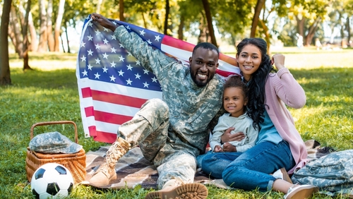 Veteran with Family at Picnic shutterstock 2092233580